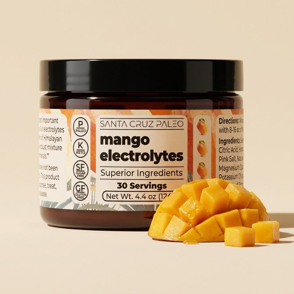 Mango electrolytes tub beside a cut mango