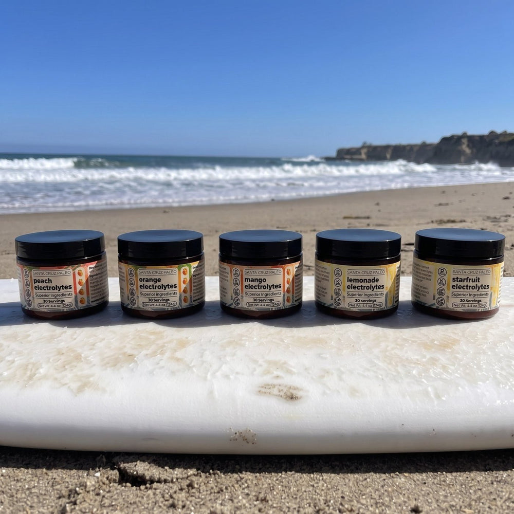 Five electrolyte tubs lined up on a surfboard