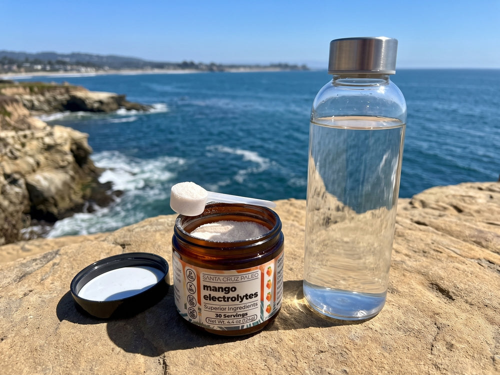 Open Mango electrolytes tub with a scoop of powder