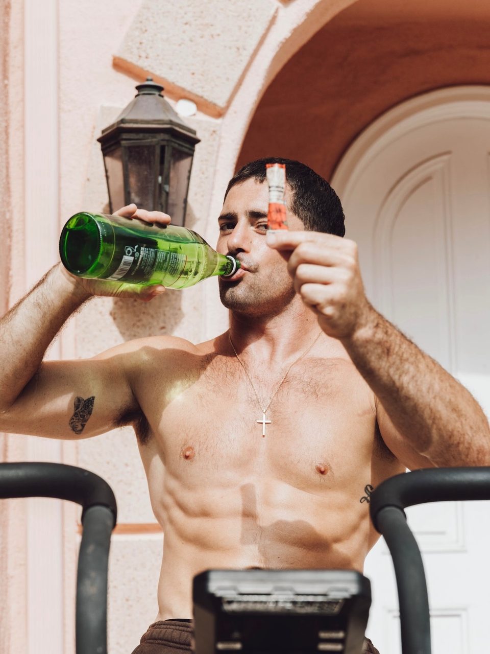 Brendan drinking, holding an electrolyte stick